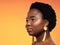 You are you and thats your superpower. Studio shot of a beautiful young woman looking thoughtful against an orange