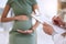 You and your baby are as healthy as ever. an unrecognisable doctor using a clipboard during a checkup with his pregnant