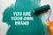 You Are Your Own Brand. Green painted wooden background