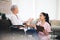 Youll be easily disheartened if you overlook progress. a young nurse talking to an older woman in a wheelchair.