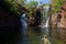 youn girl enjoy srefreshing swim at Florence Falls, very popular desitination for tourists and locals alike, Litchfield National
