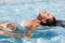 Yound beautiful woman rests at the pool
