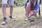 Yound female hiker tying her shoe