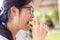 Yound female teenager eating her sandwich and pizza for lunch