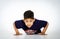 Young active afro-american boy doing gymnastics