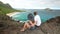Young active couple sitting and looking at view in Makapuu Lookout, Oahu, Hawaii