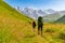 Young active girls hiking in Greater Caucasus mountains, Mestia district, Svaneti, Georgia