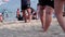 Young active people enjoy playing ball on the sandy beach