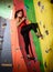 Young Active Woman Bouldering on Colorful Artificial Rock in Climbing Gym. Extreme Sport and Indoor Climbing Concept