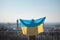 Young activist flies the Ukrainian flag in support of one sovereign state against the tyranny of another. To be heard and seen. No