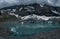 Young admiring the natural beauty of a glaciar lake in Swiss Alps