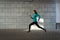 Young adult athlete woman jogging outdoor in city