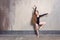 Young adult ballet dancer posing in studio. Contemporary dance p