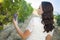 Young Adult Brunette Woman Enjoying The Wine Grapes in The Vineyard