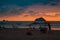 A young adult couple contemplating the beautiful evening on the beach of the tropical Pacific in the Manuel Antonio National Park