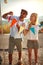 young adult couple using colorful little flags in shape of triangles for decoration