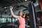 Young adult fitness woman doing pull ups