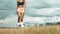 Young adult girl close up playing football or soccer, kicking a ball with her knee Beautiful brunette woman in a sports