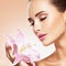 Young adult  girl smells flower. skin care beauty