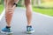 Young adult male with his muscle pain during running. runner man having leg ache due to Calf muscle pull. Sports injuries and