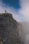 Young adult man hiker contemplating volcanic landscape atop a sandy rise in Rincon de la Vieja National Park Guanacaste Costa Rica