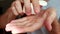 Young adult man holding painkiller pills on male hand pouring capsules from meds bottle. 