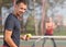 Young adult man playing tennis and preparing for sports competition.