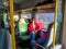 Young adult man rides an electric train on the route Warsaw - Modlin in Poland. Dark-haired guy in sunglasses and a red jacket