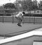 Young Adult Skateboarding With Headphones