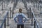 Young adult sporty woman  looking at stairs, preparing to training