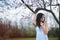 Young adult woman portrait tree blossom