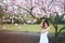 Young adult woman portrait tree blossom