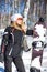 Young adult woman snowboarder holding snow board