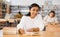 Young adult woman studying in public library