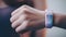 Young adults exercising, holding smart watches, texting generated by AI