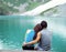 Young Adults Lovers Looking at Pristine Aqua Mountain Lake