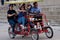 Young Adults Pedal A Four-Wheeled Cycle In Chicago