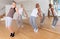 Young adults practicing dance movements in choreography class