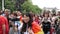 Young adults and seniors walking LGBT pride parade on streets