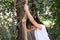 Young Adventurer Ready to Climb Rope in Backyard Oasis.