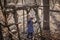 Young adventurers building a wooden habitat in the wild forest during social distant walking