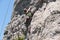 Young adventurous person rock climbing