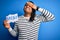 Young african american afro man holding banner with brexit message over blue background stressed with hand on head, shocked with