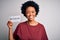 Young African American afro politician woman with curly hair socialist party member with a happy face standing and smiling with a