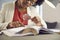 Young african american Bbusiness woman reading looking through magnifying glass