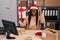 Young african american with braids working at small business ecommerce at christmas annoyed and frustrated shouting with anger,