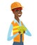 Young african-american builder holding money.
