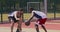 Young african american and caucasian basketball players playing at outdoor court, practicing attack and defence