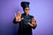 Young african american chef girl wearing cooker uniform and hat over purple background doing stop gesture with hands palms, angry