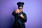 Young african american chef girl wearing cooker uniform and hat over purple background Punching fist to fight, aggressive and